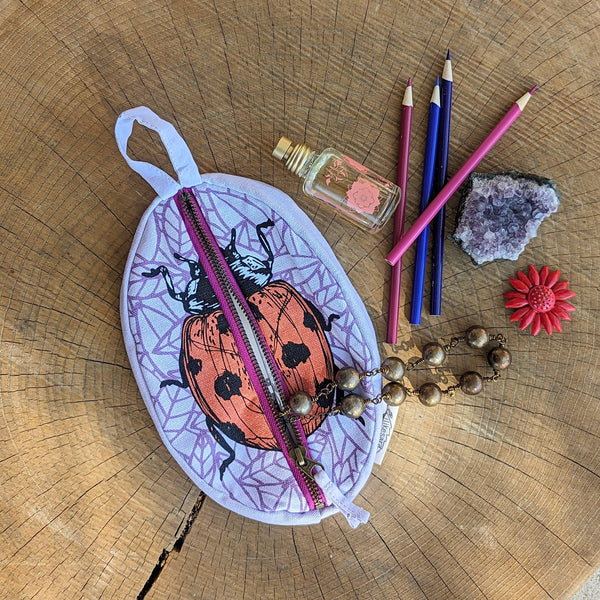 ilikesara | art + goods - Zippered pouch | ladybug - purple & red insect pencil, supply, makeup bag with waterproof lining