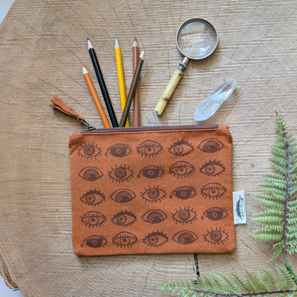 ilikesara | art + goods - Zippered pouch | eyeball - rust orange eye blockprint pencil, supply, makeup bag with waterproof lining