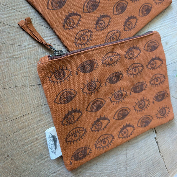 ilikesara | art + goods - Zippered pouch | eyeball - rust orange eye blockprint pencil, supply, makeup bag with waterproof lining